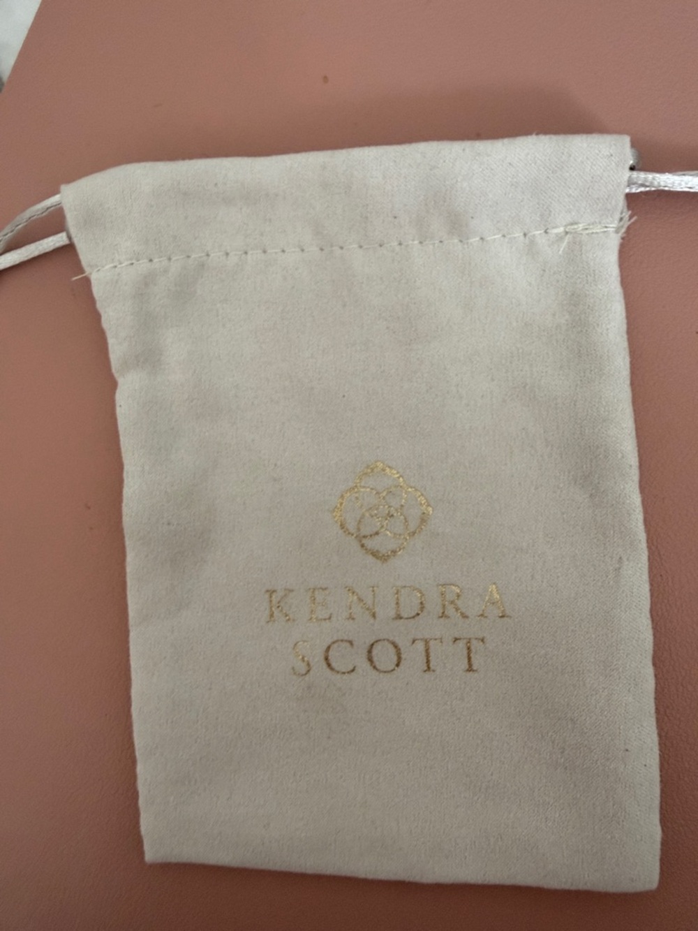 Kendra Scott Cream Velvet Pouch with Gold Logo